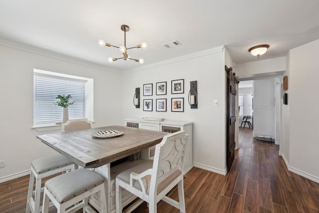 310 Yorkshire Ln, Port Neches, TX 77651 - dining area with an inviting chandelier, visible vents, ornamental molding, dark wood-type flooring, and baseboards