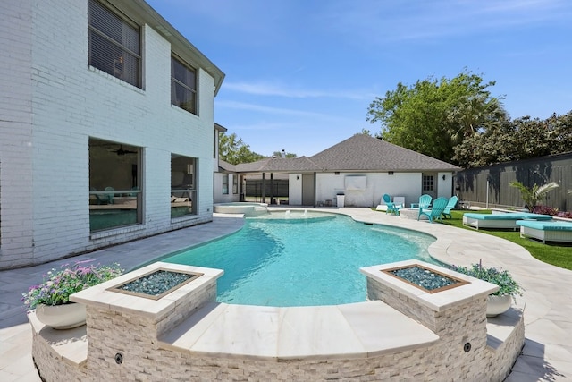 310 Yorkshire Ln, Port Neches, TX 77651 - view of pool with a fenced backyard, an outdoor fire pit, a pool with connected hot tub, and a patio