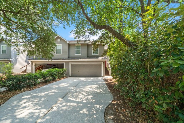 38 Wineberry Pl, The Woodlands, TX 77382 - view of front of property with driveway and an attached garage