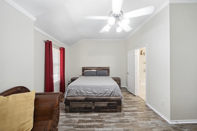 38 Wineberry Pl, The Woodlands, TX 77382 - bedroom featuring wood finished floors, ornamental molding, vaulted ceiling, baseboards, and connected bathroom
