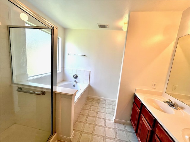 19334 Little Pine Ln, Katy, TX 77449 - bathroom with tile patterned floors, a sink, double vanity, a stall shower, and visible vents