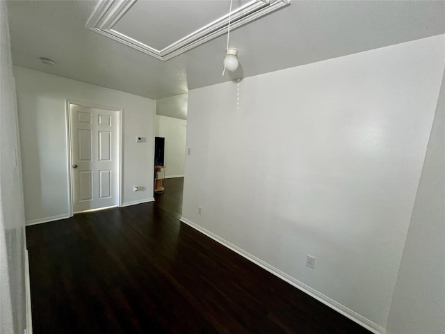 19334 Little Pine Ln, Katy, TX 77449 - spare room with attic access, baseboards, and dark wood finished floors