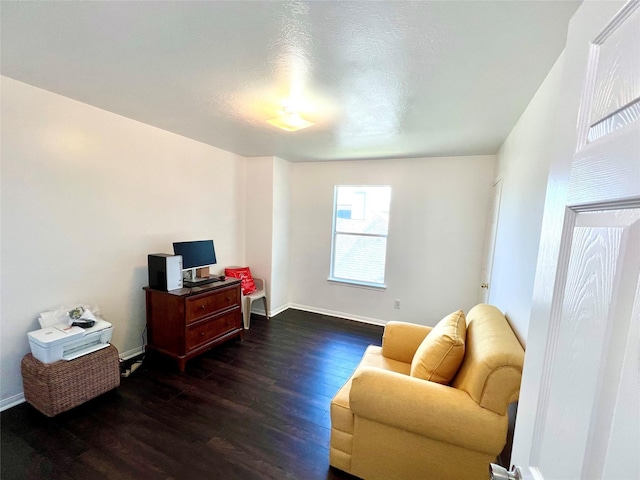 19334 Little Pine Ln, Katy, TX 77449 - living area with baseboards and dark wood-style flooring