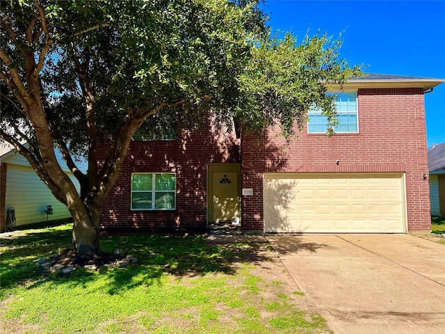 19334 Little Pine Ln, Katy, TX 77449 - view of front of home featuring a front lawn, driveway, brick siding, and a garage