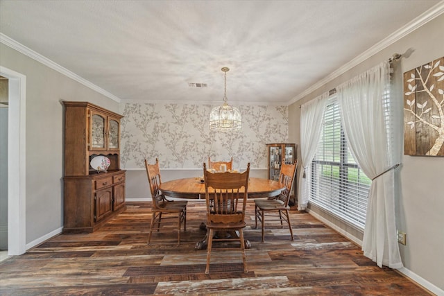dining room featuring crown molding, dark wood finished floors, baseboards, and visible vents