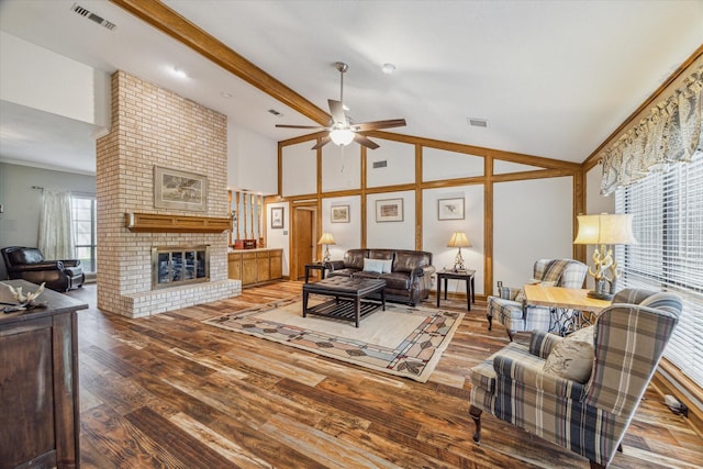 living room with visible vents, a brick fireplace, wood finished floors, ceiling fan, and high vaulted ceiling