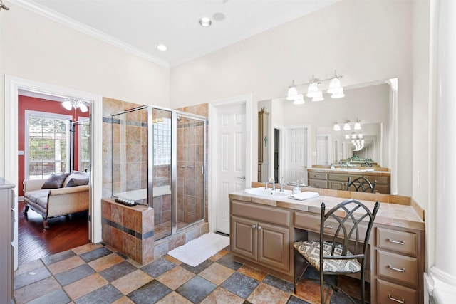 4304 Newcastle Ct, Bryan, TX 77802 - full bathroom featuring a shower stall, vanity, ornamental molding, and connected bathroom