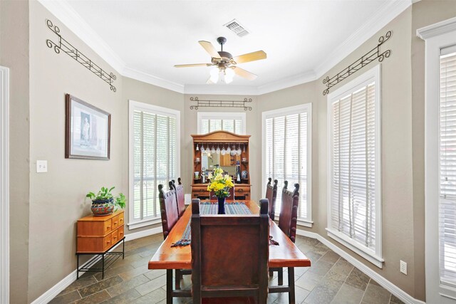4304 Newcastle Ct, Bryan, TX 77802 - dining room with healthy amount of natural light, ornamental molding, ceiling fan, baseboards, and stone tile floors