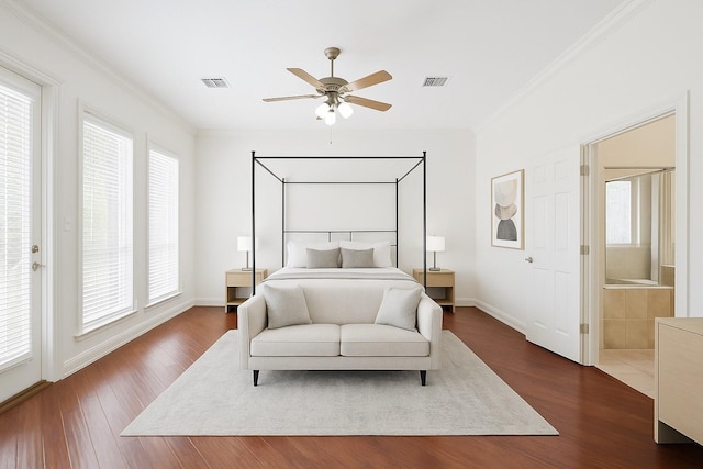 4304 Newcastle Ct, Bryan, TX 77802 - bedroom with multiple windows, ornamental molding, and dark wood-type flooring