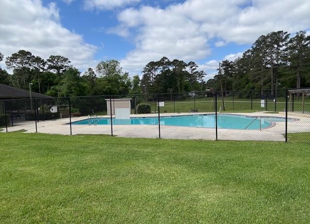 11 Ridgeway St, Coldspring, TX 77331 - community pool with a lawn and fence