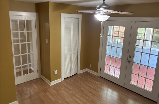 11 Ridgeway St, Coldspring, TX 77331 - entryway with wood finished floors, baseboards, ceiling fan, and french doors