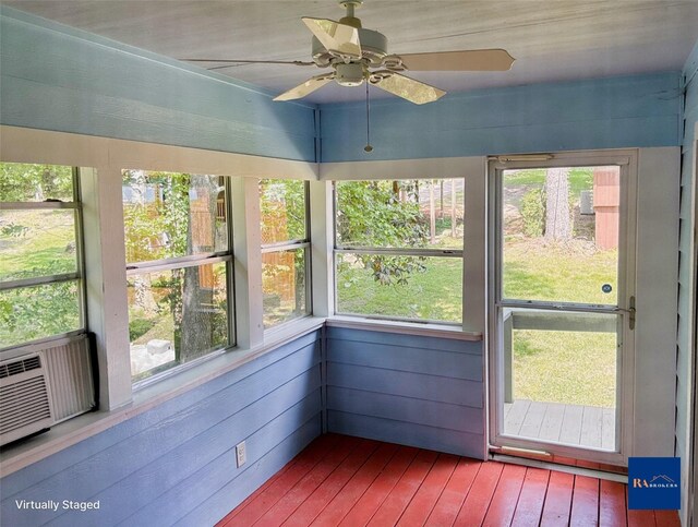11 Ridgeway St, Coldspring, TX 77331 - unfurnished sunroom with wood-type flooring, a ceiling fan, and plenty of natural light