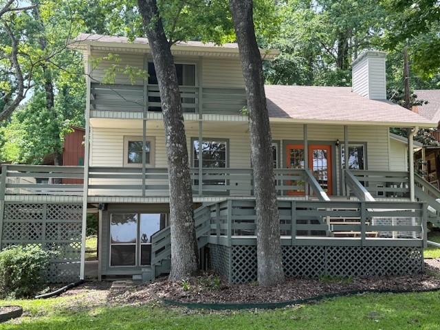 11 Ridgeway St, Coldspring, TX 77331 - rear view of house with a chimney