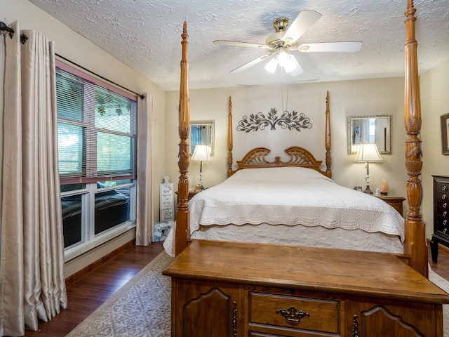 1814 Cliffdale Dr, Missouri City, TX 77489 - bedroom with a ceiling fan, a textured ceiling, and dark wood-style flooring