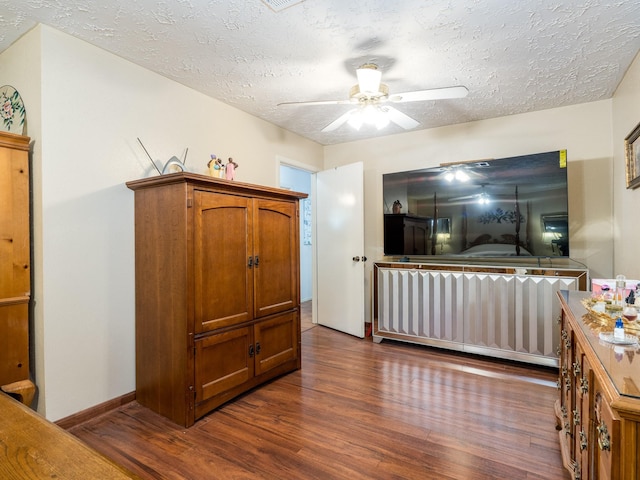 1814 Cliffdale Dr, Missouri City, TX 77489 - interior space with ceiling fan, a textured ceiling, baseboards, and dark wood-style flooring