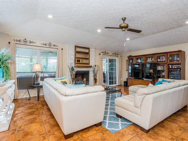 1814 Cliffdale Dr, Missouri City, TX 77489 - living area featuring ceiling fan, a brick fireplace, a textured ceiling, and recessed lighting