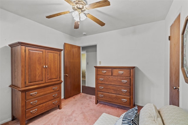 bedroom featuring light colored carpet and ceiling fan