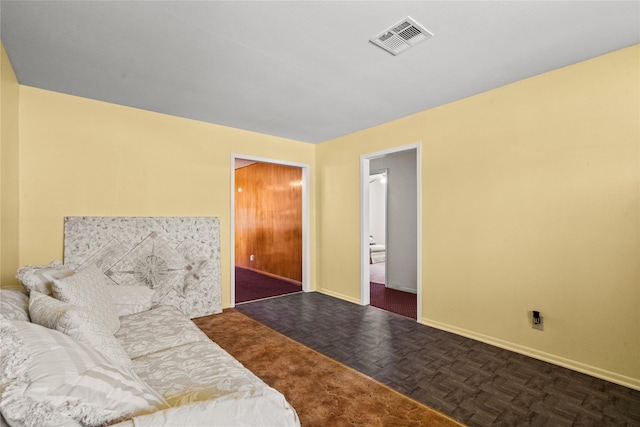 interior space featuring baseboards and visible vents