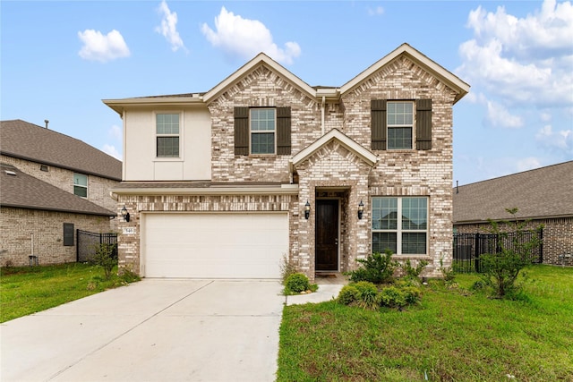 546 Long Beach Bay Dr, Katy, TX 77493 - view of front facade featuring driveway, an attached garage, fence, a front yard, and brick siding