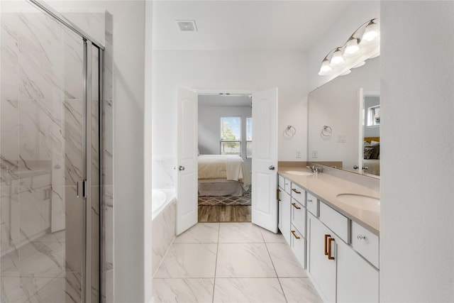 546 Long Beach Bay Dr, Katy, TX 77493 - full bathroom featuring marble finish floor, ensuite bathroom, visible vents, and a sink