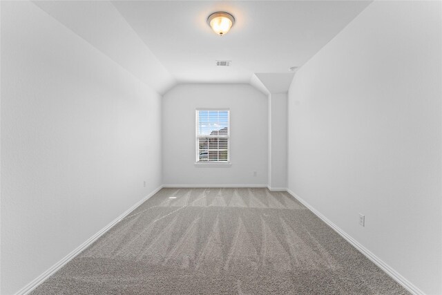 546 Long Beach Bay Dr, Katy, TX 77493 - additional living space with lofted ceiling, baseboards, visible vents, and carpet