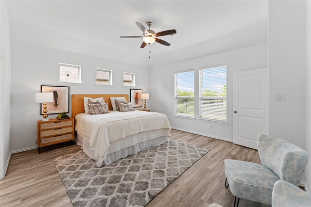 546 Long Beach Bay Dr, Katy, TX 77493 - bedroom with baseboards, a ceiling fan, and light wood-style flooring