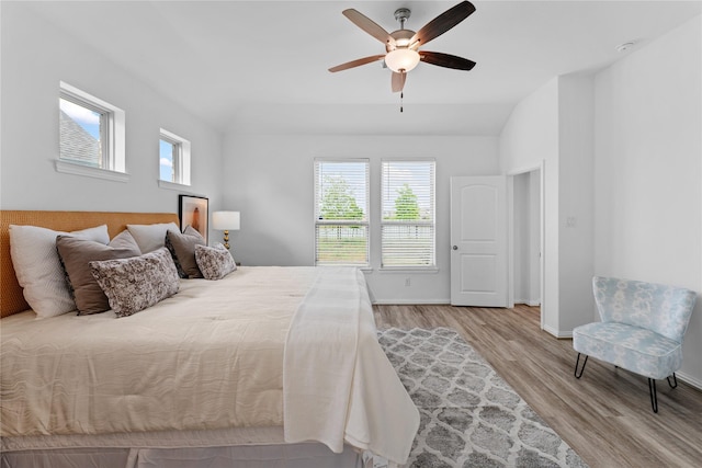 546 Long Beach Bay Dr, Katy, TX 77493 - bedroom with ceiling fan, baseboards, wood finished floors, and multiple windows