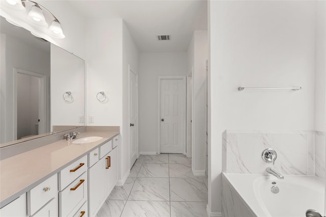 546 Long Beach Bay Dr, Katy, TX 77493 - bathroom with marble finish floor, visible vents, vanity, a bath, and baseboards