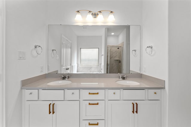 546 Long Beach Bay Dr, Katy, TX 77493 - full bath featuring a sink, double vanity, and a stall shower