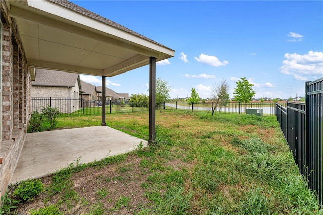 546 Long Beach Bay Dr, Katy, TX 77493 - view of yard featuring a patio area, a fenced backyard, and a water view