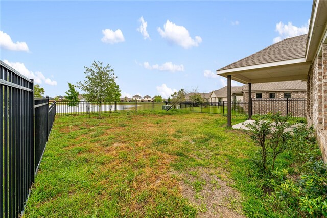 546 Long Beach Bay Dr, Katy, TX 77493 - view of yard featuring fence and a water view