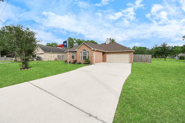 3011 Fairchild Ave, Needville, TX 77461 - single story home featuring fence, a front lawn, concrete driveway, brick siding, and a garage