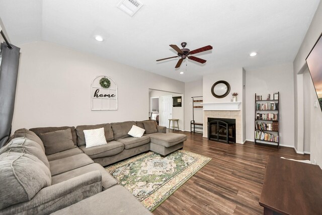 3011 Fairchild Ave, Needville, TX 77461 - living room with a ceiling fan, a tile fireplace, baseboards, dark wood-style flooring, and visible vents