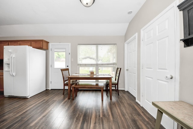3011 Fairchild Ave, Needville, TX 77461 - dining room featuring vaulted ceiling and dark wood-style flooring