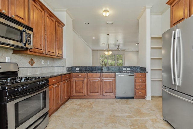 91 Sidney St, Houston, TX 77003 - kitchen with brown cabinets, stainless steel appliances, visible vents, a sink, and dark stone counters