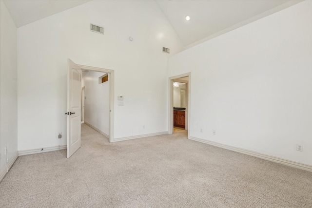 91 Sidney St, Houston, TX 77003 - unfurnished bedroom featuring high vaulted ceiling, baseboards, visible vents, and light colored carpet