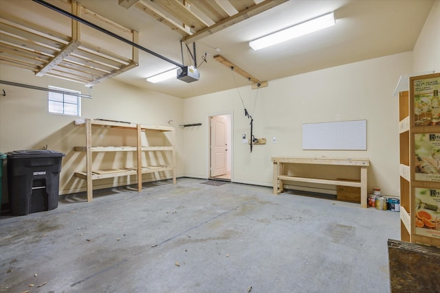 91 Sidney St, Houston, TX 77003 - garage with a workshop area and a garage door opener