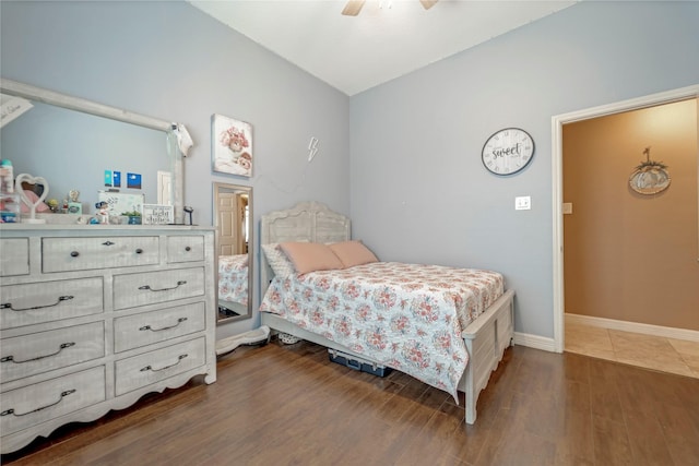 606 Sea Anchor Way, Crosby, TX 77532 - bedroom with baseboards, a ceiling fan, and dark wood-style floors