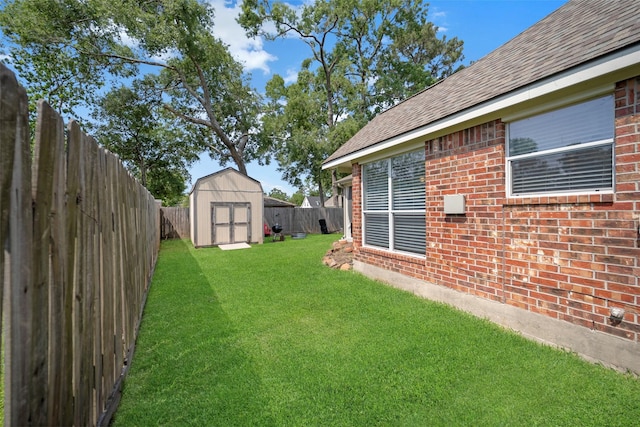 606 Sea Anchor Way, Crosby, TX 77532 - view of yard featuring an outdoor structure, a storage shed, and a fenced backyard