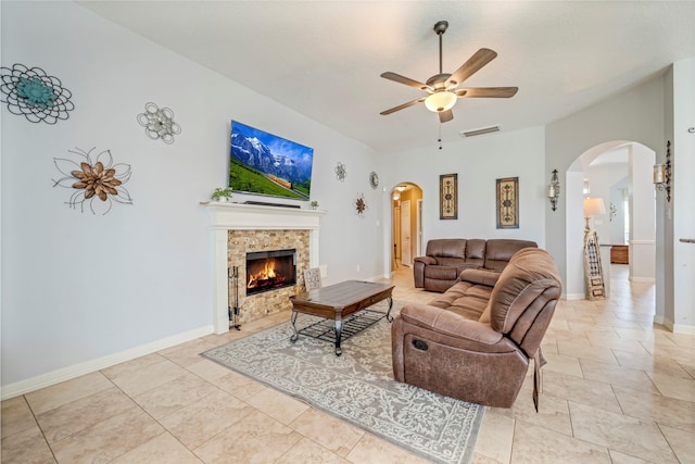 606 Sea Anchor Way, Crosby, TX 77532 - living room featuring a fireplace, visible vents, a ceiling fan, and arched walkways