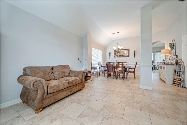 606 Sea Anchor Way, Crosby, TX 77532 - living room featuring a chandelier, baseboards, arched walkways, and lofted ceiling