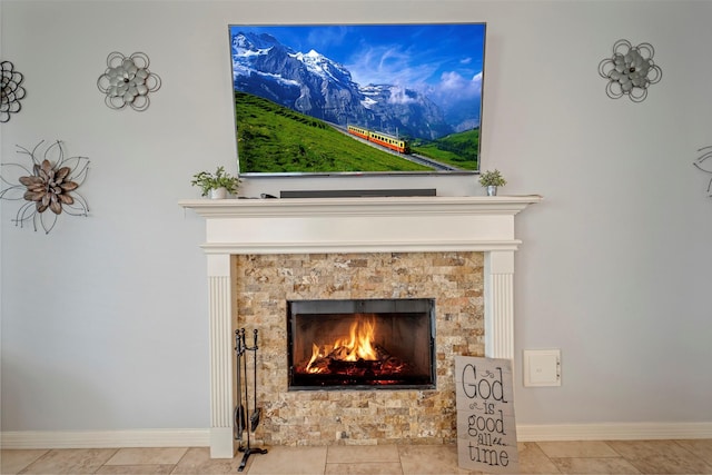 606 Sea Anchor Way, Crosby, TX 77532 - details with a tiled fireplace and baseboards