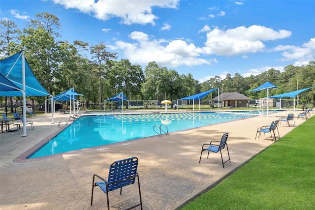 606 Sea Anchor Way, Crosby, TX 77532 - community pool featuring a patio and fence
