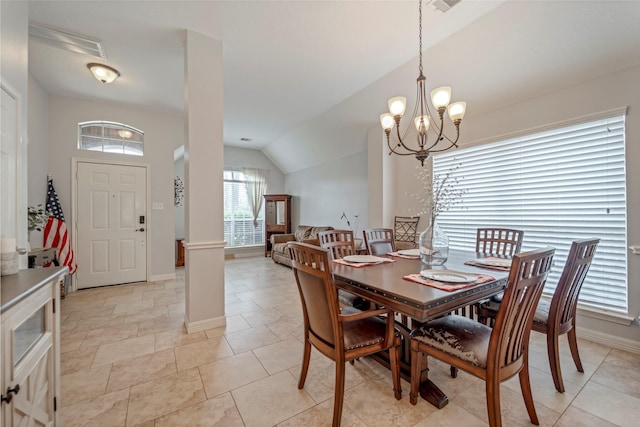 606 Sea Anchor Way, Crosby, TX 77532 - dining area with vaulted ceiling, baseboards, and an inviting chandelier