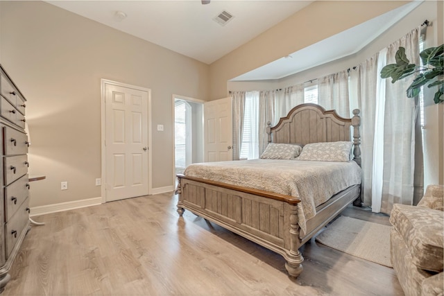 606 Sea Anchor Way, Crosby, TX 77532 - bedroom featuring baseboards, visible vents, and light wood-style floors