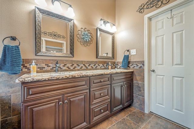606 Sea Anchor Way, Crosby, TX 77532 - full bath with tile walls, stone tile flooring, double vanity, and a sink