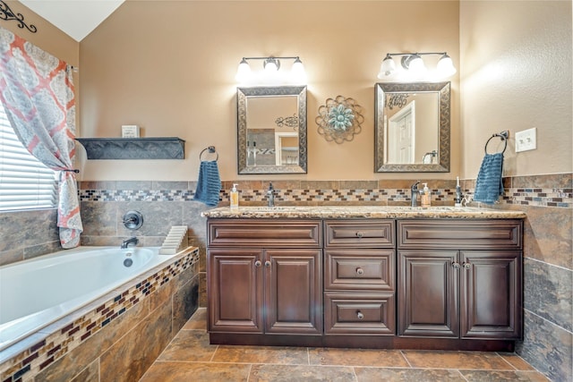 606 Sea Anchor Way, Crosby, TX 77532 - full bathroom featuring a garden tub, tile walls, a sink, and double vanity