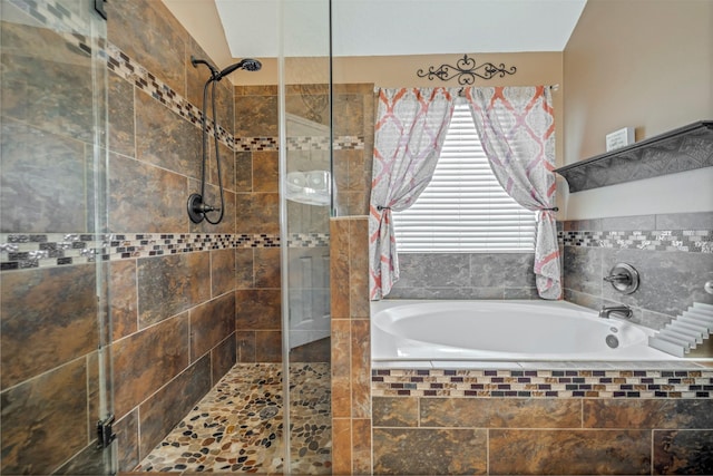 606 Sea Anchor Way, Crosby, TX 77532 - bathroom featuring a bath and a shower stall
