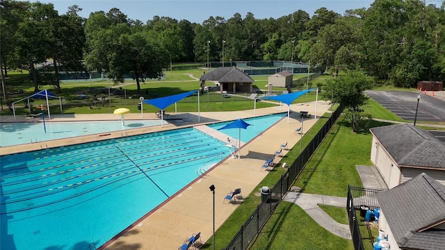 606 Sea Anchor Way, Crosby, TX 77532 - community pool with fence and a yard