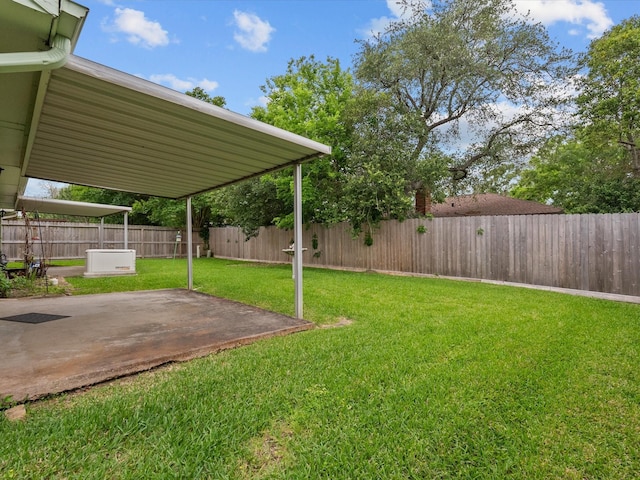 view of yard with a fenced backyard and a patio